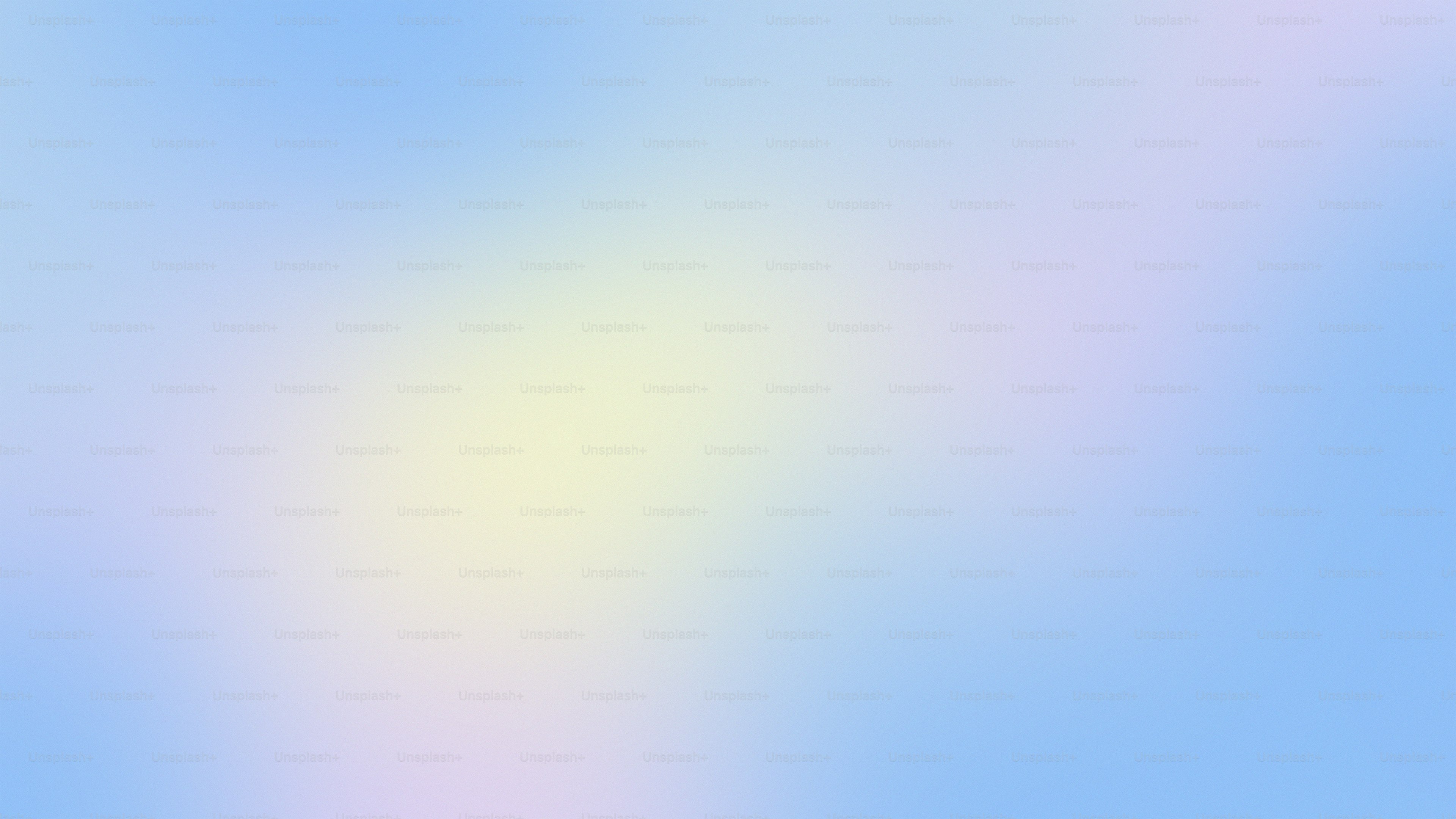 a blurry image of a blue sky with clouds