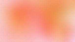 a blurry image of an orange and pink background