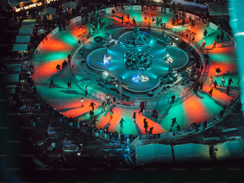 an aerial view of a fountain at night