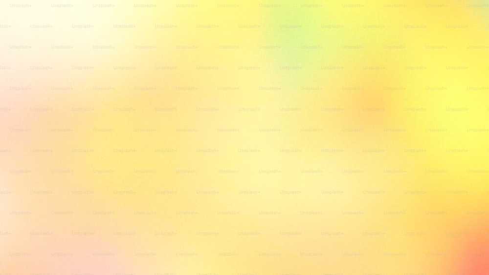 a blurry image of a yellow and pink background
