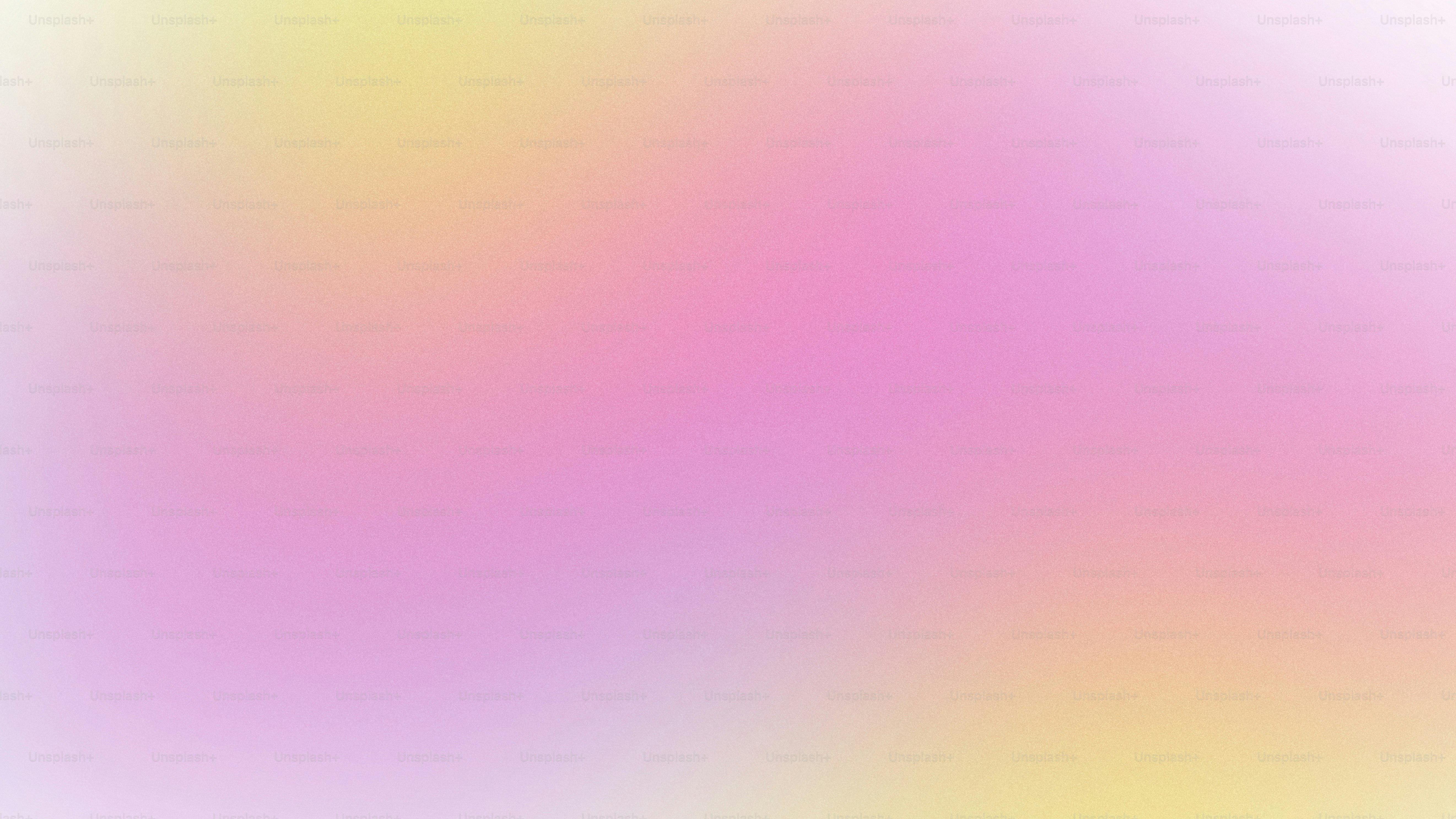 ピンクと黄色の背景のぼやけた画像