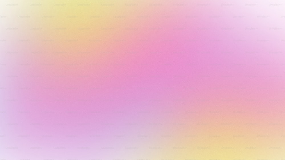 ein verschwommenes Bild mit einem rosa und gelben Hintergrund