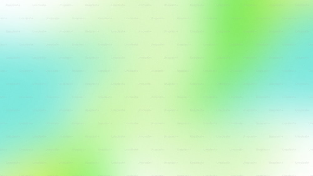 a blurry image of a green and blue background
