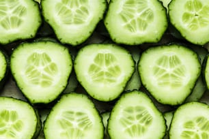 a bunch of cucumbers that are cut in half