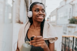 a woman wearing headphones and a towel