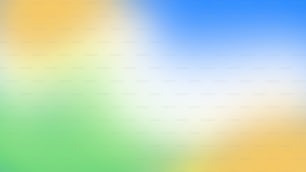 a blurry image of a blue, yellow and green background