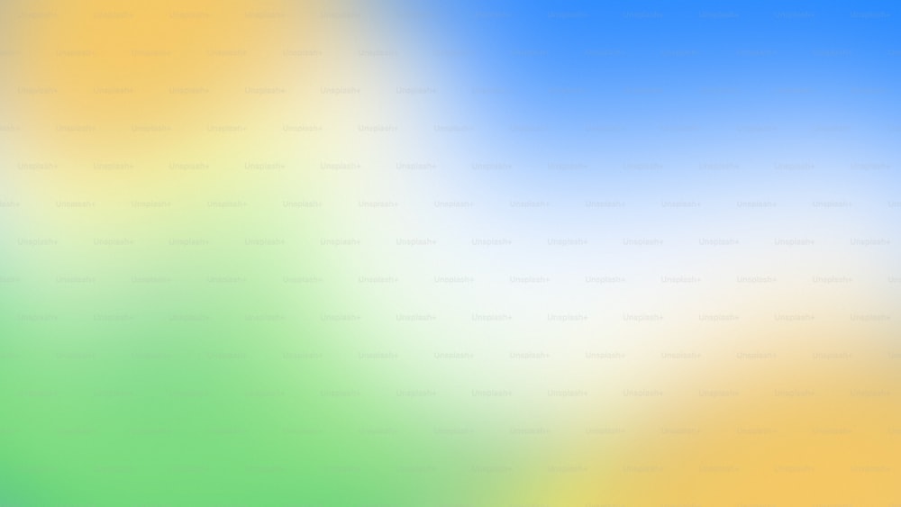 a blurry image of a blue, yellow and green background