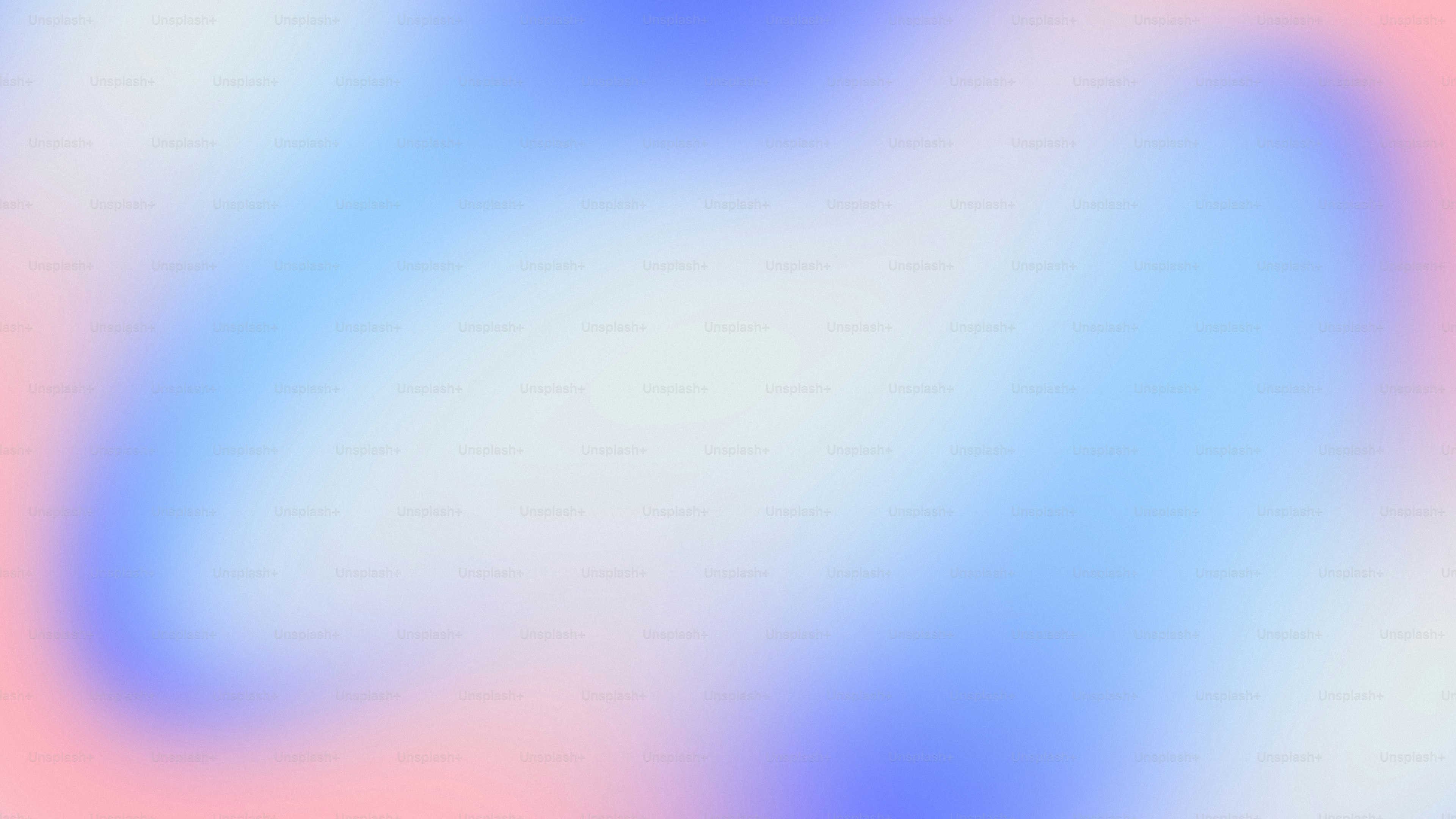 a blurry image of a blue and pink background