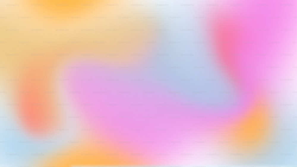 a blurry image of a pink, yellow and blue background