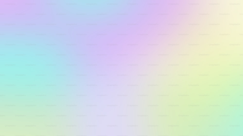 a blurry image of a rainbow colored background