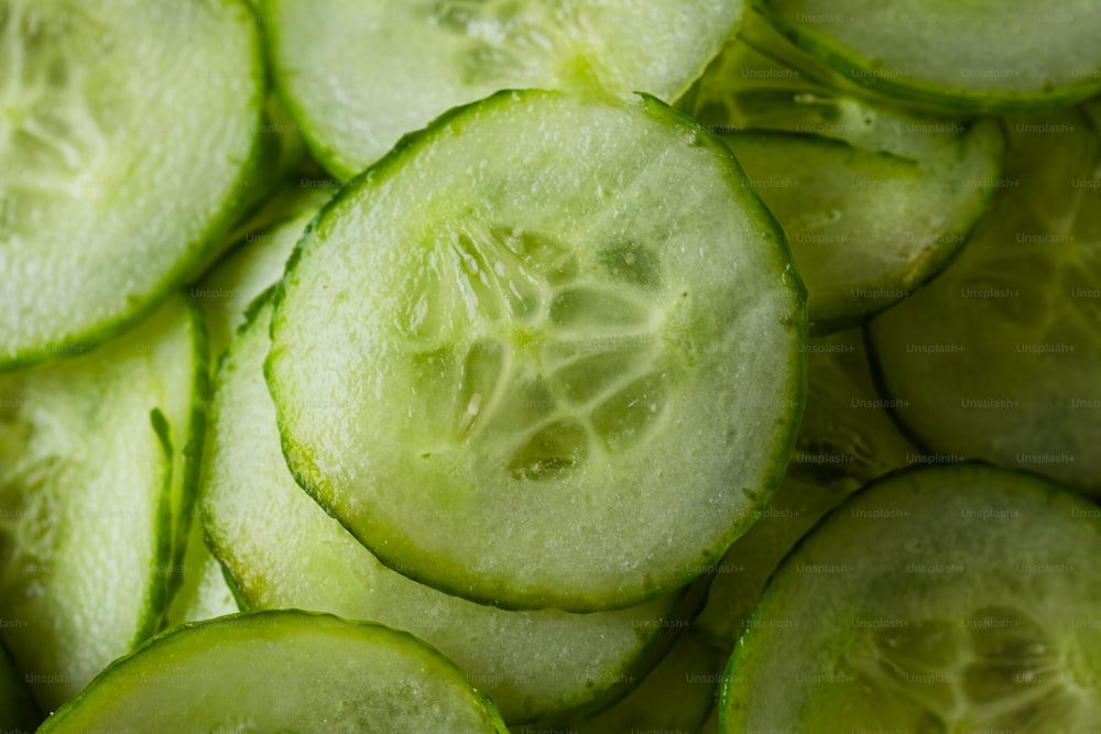 a pile of sliced cucumbers sitting on top of a table