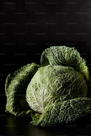 a pile of lettuce sitting on top of a table
