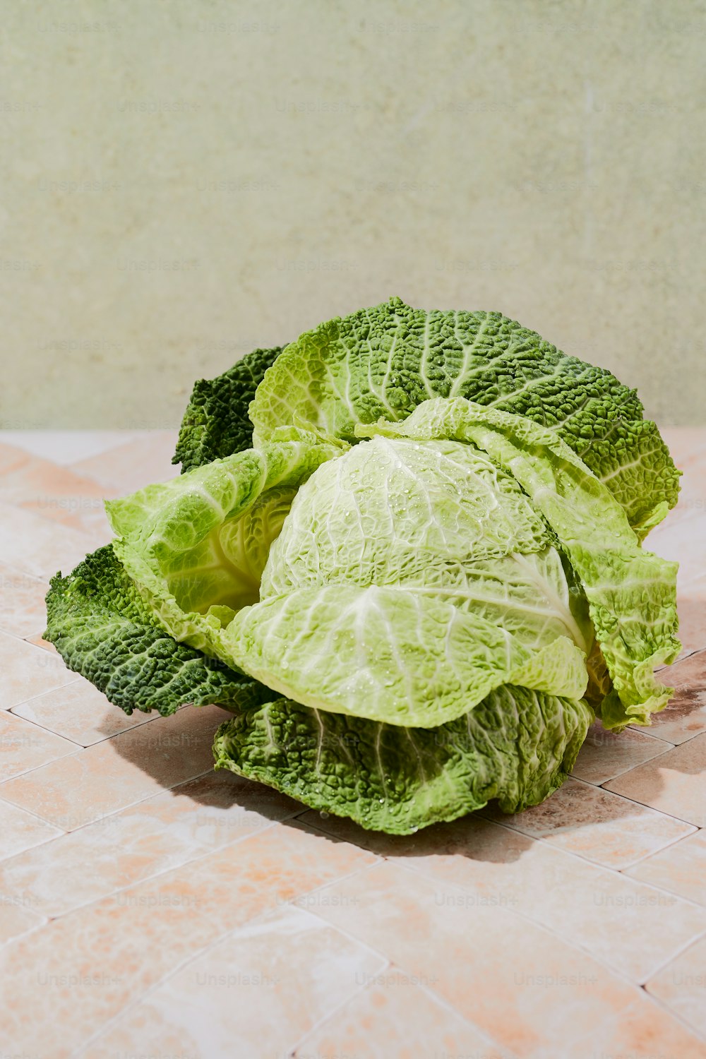 a head of lettuce sitting on top of a table