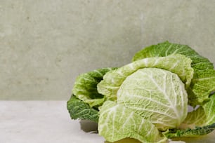 a head of cabbage sitting on top of a table