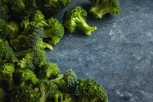 a bunch of broccoli laying on top of a table