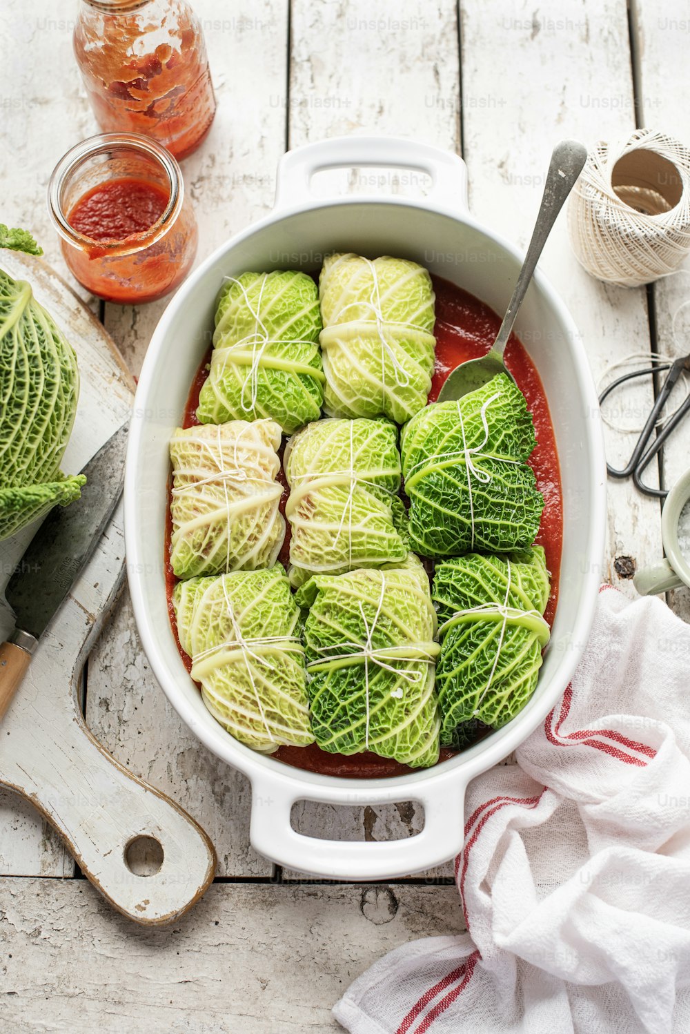 a pot filled with green cabbage covered in sauce