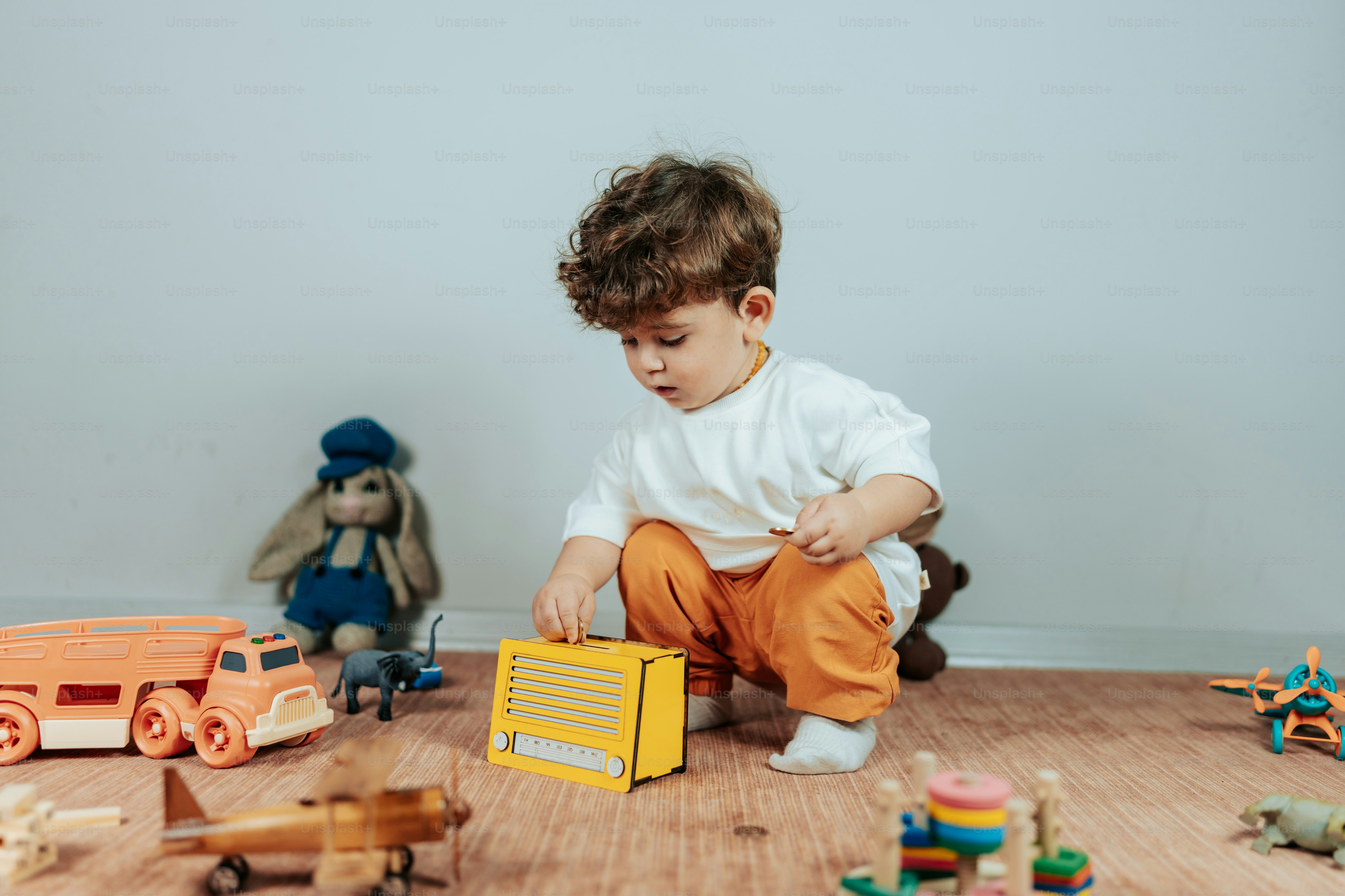 a toddler playing with toys on the floor