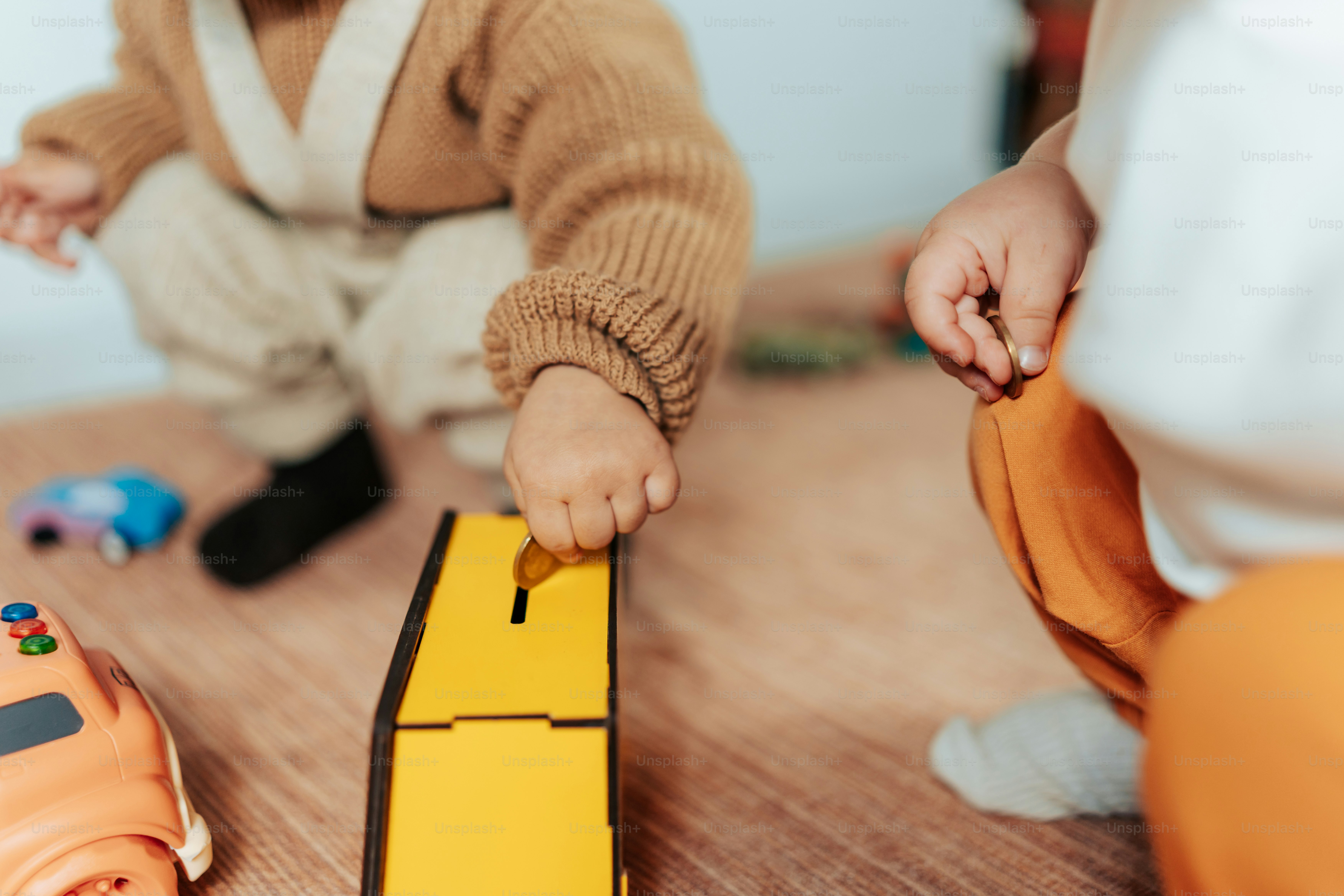 a child playing with a toy boat on the floor