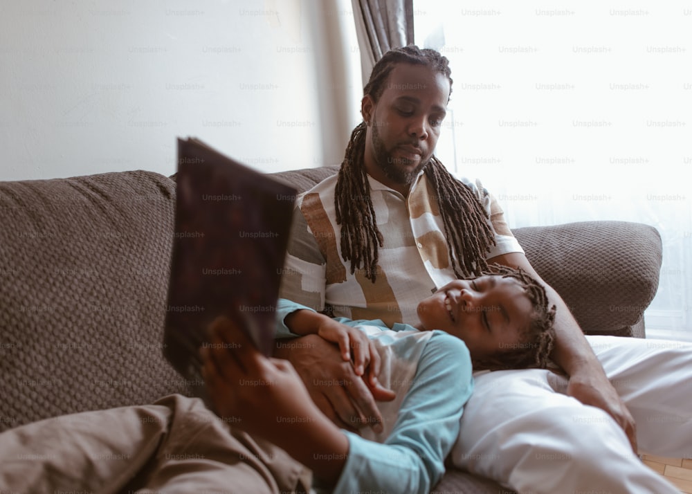 a man and a woman sitting on a couch