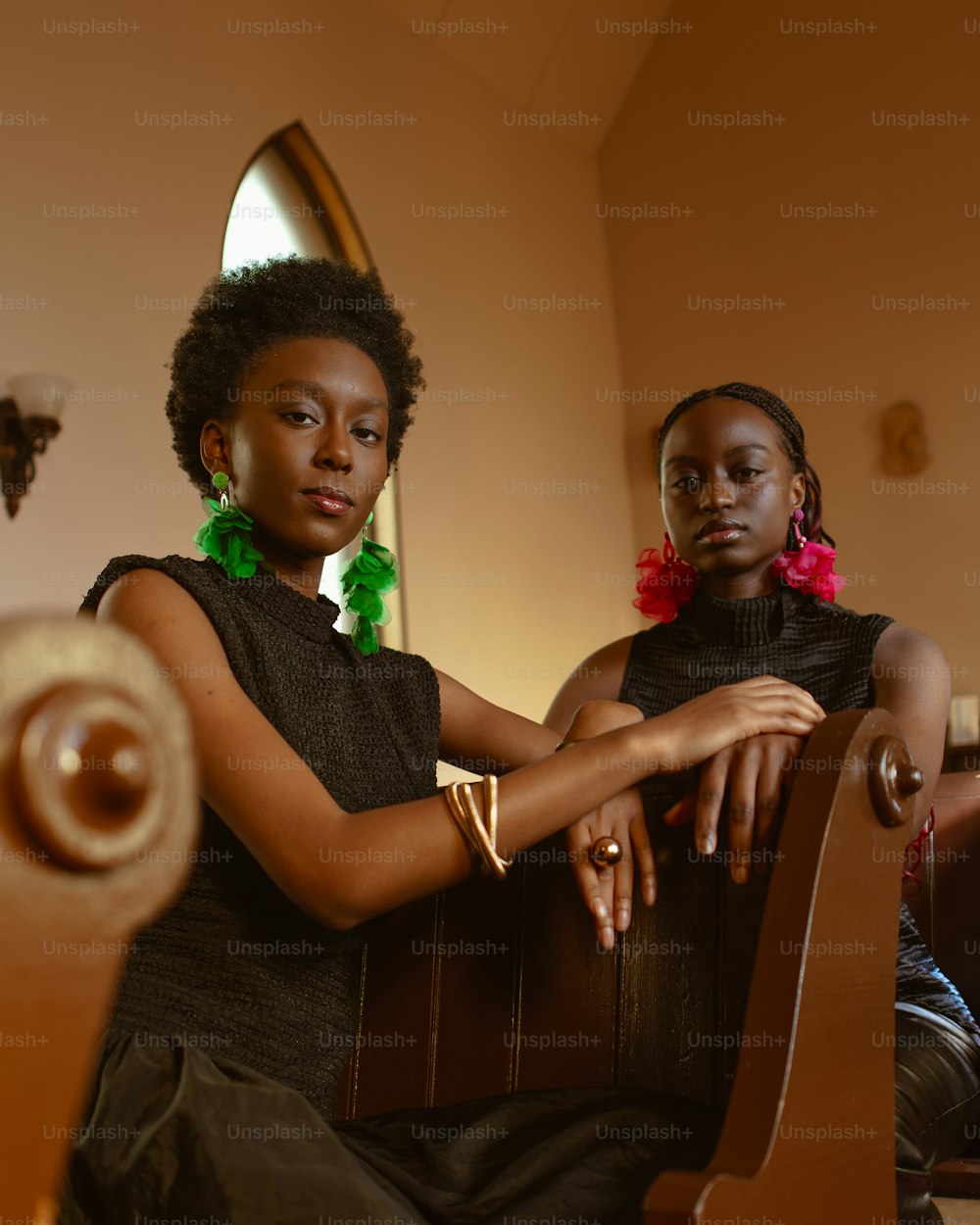 a couple of women sitting next to each other