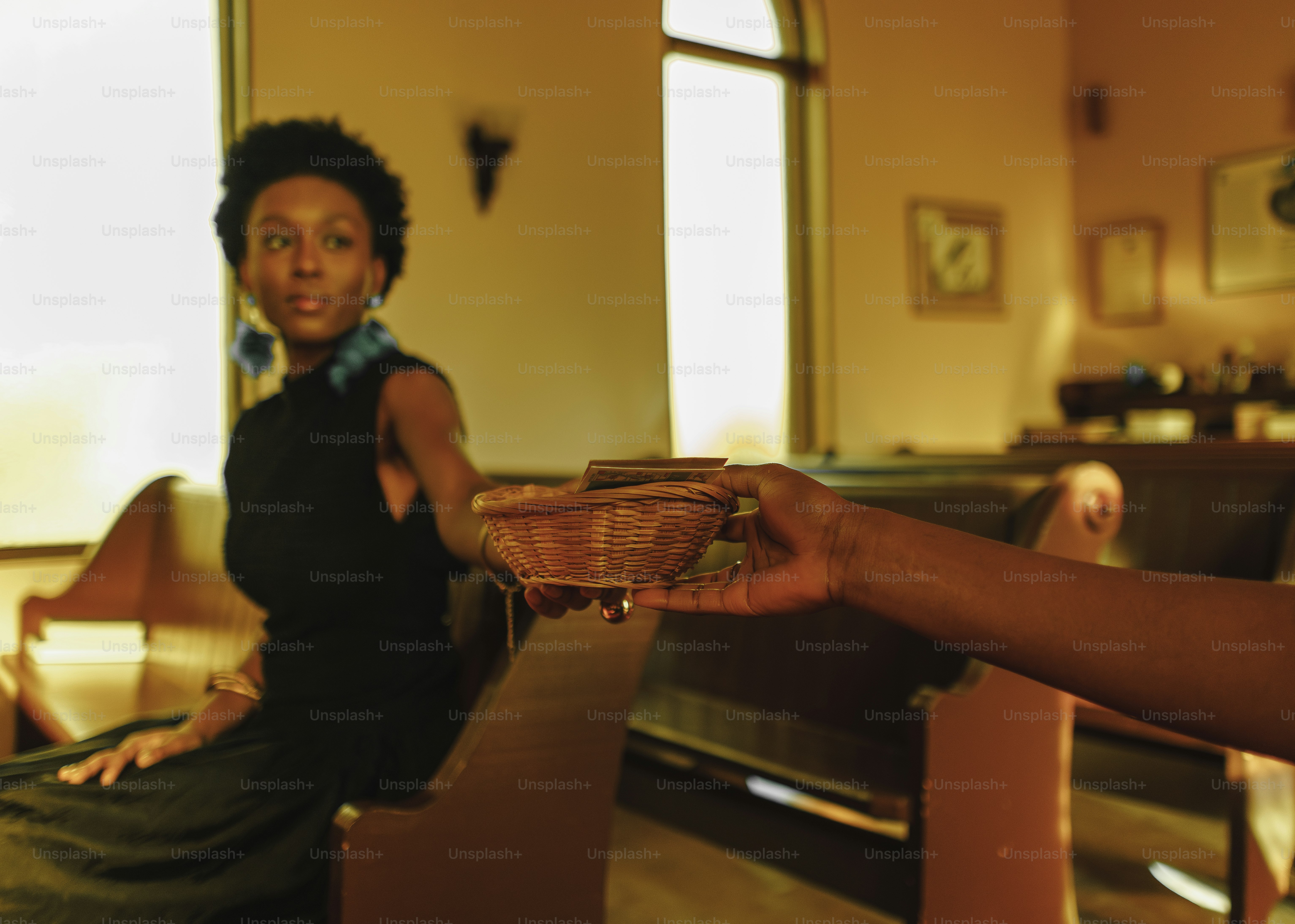 a woman is holding a basket in her hand