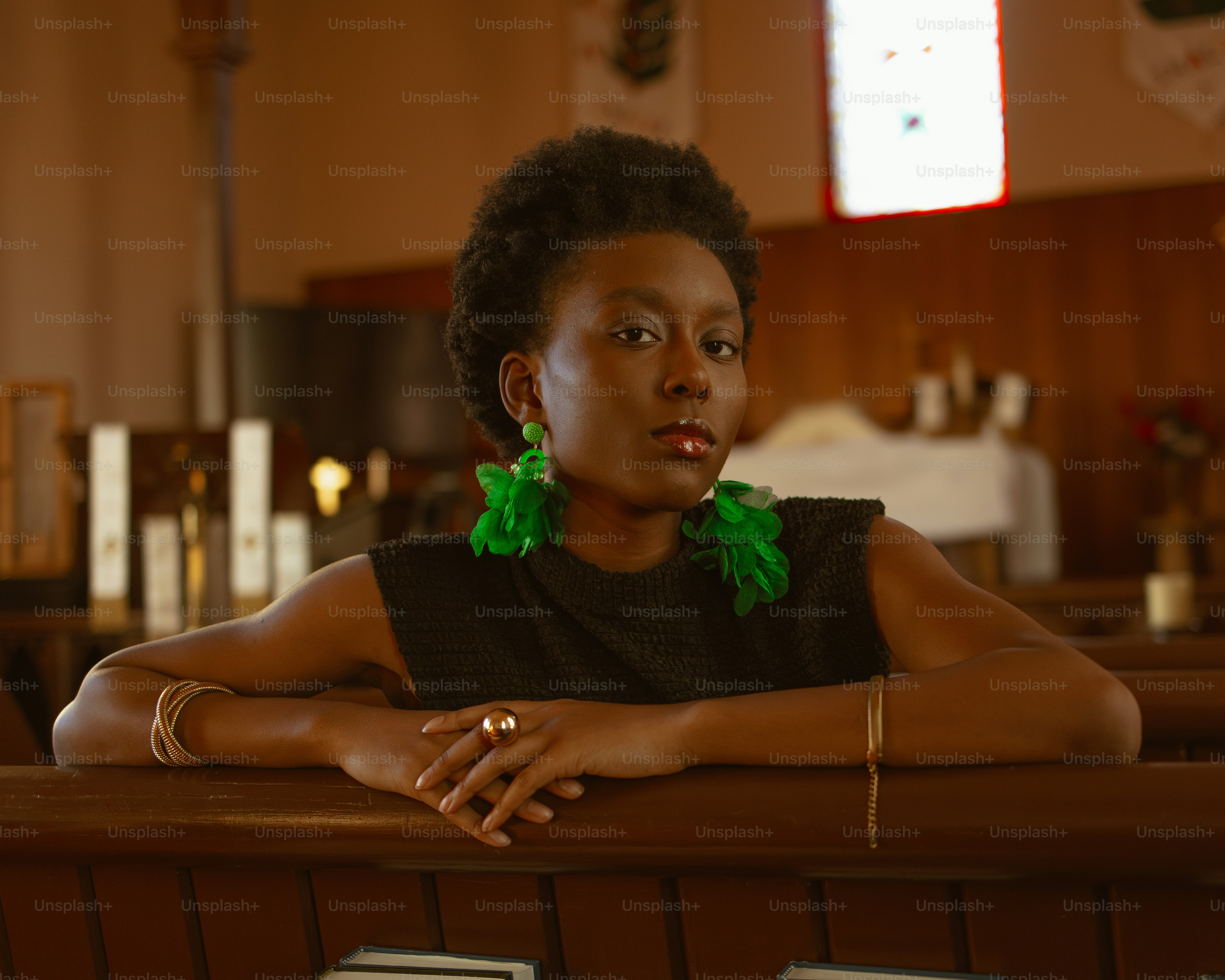 a woman sitting in a pew in a church