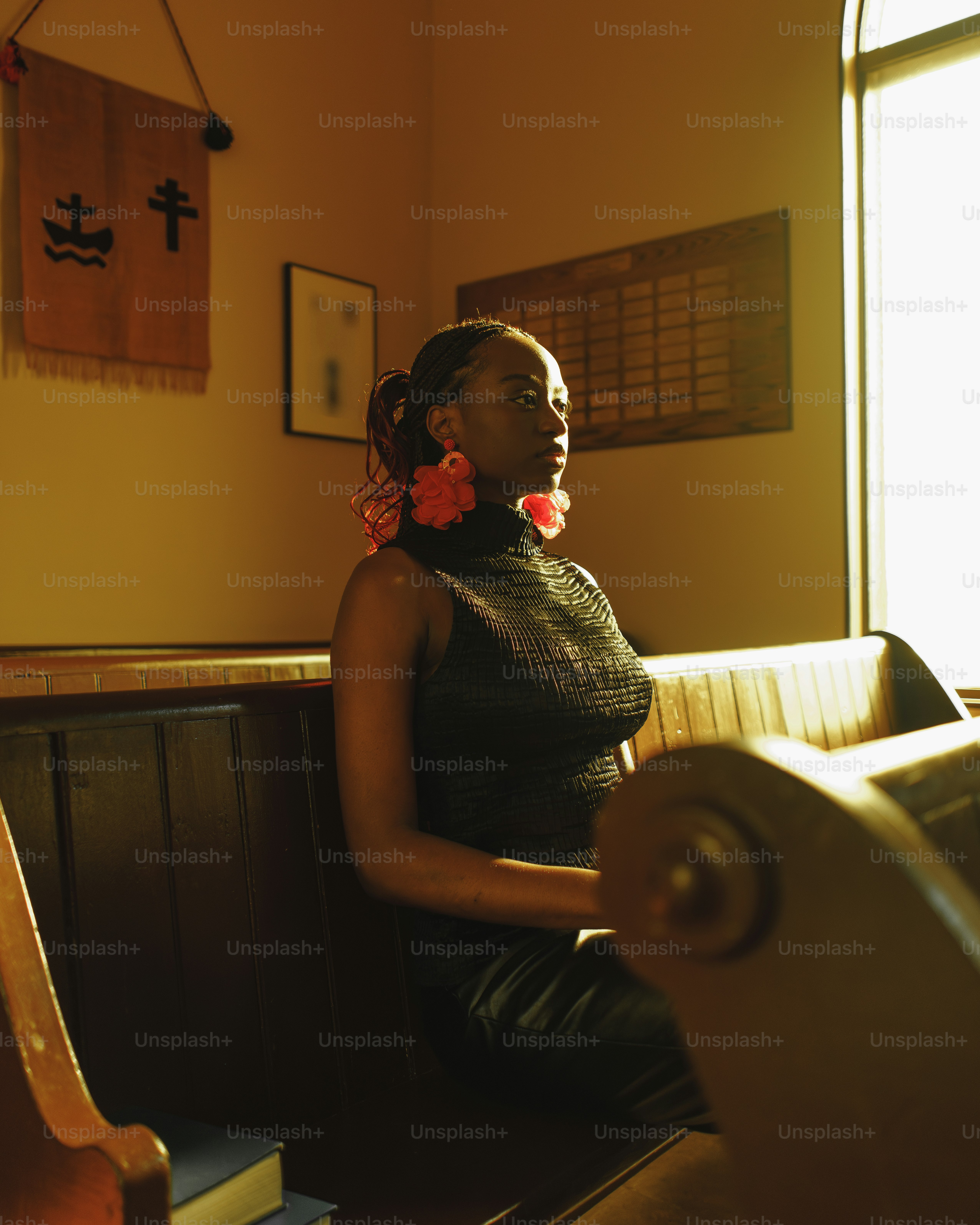 a woman sitting on a bench in a room