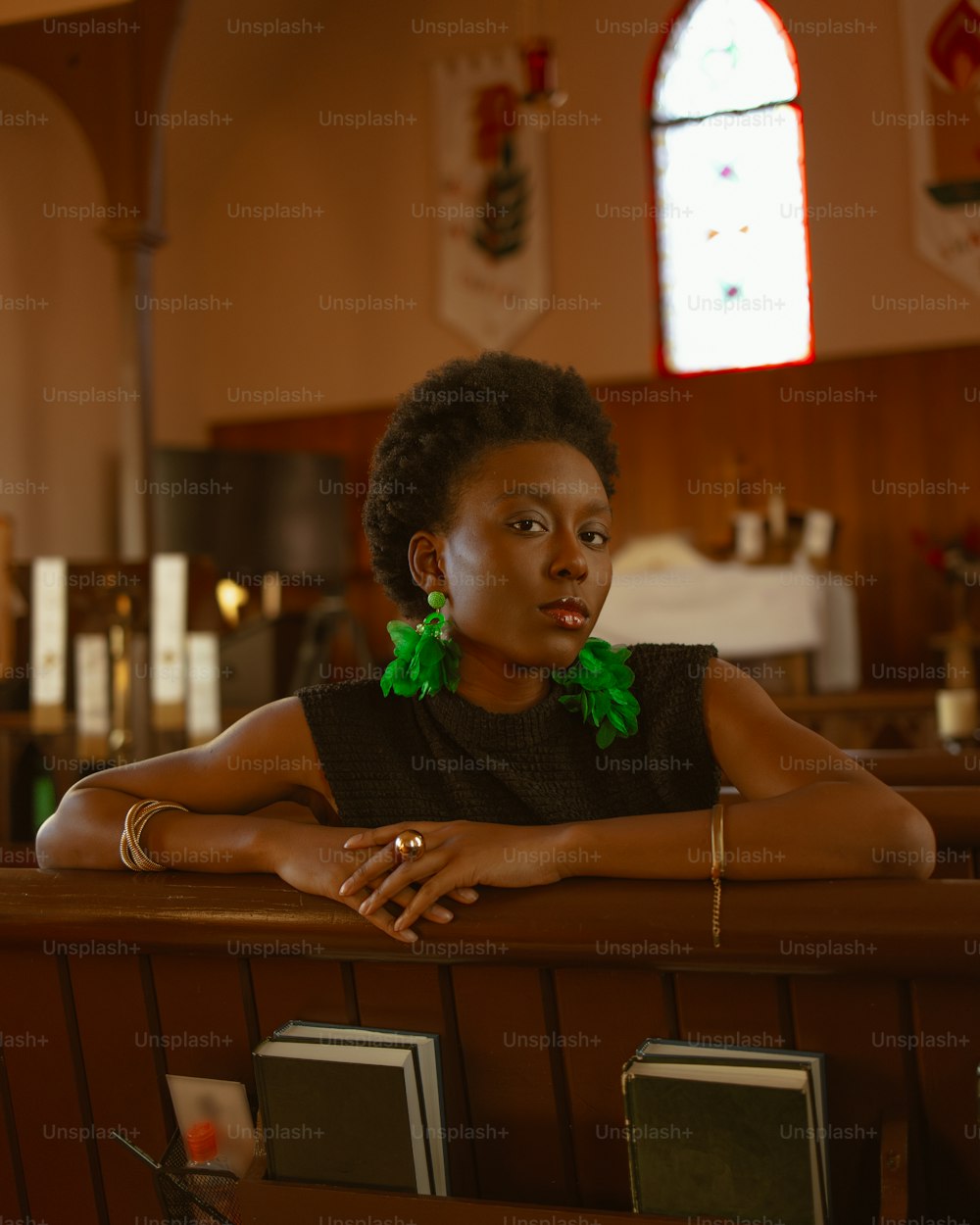 a woman sitting at a pew in a church