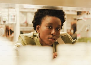 a woman looking at herself in the mirror