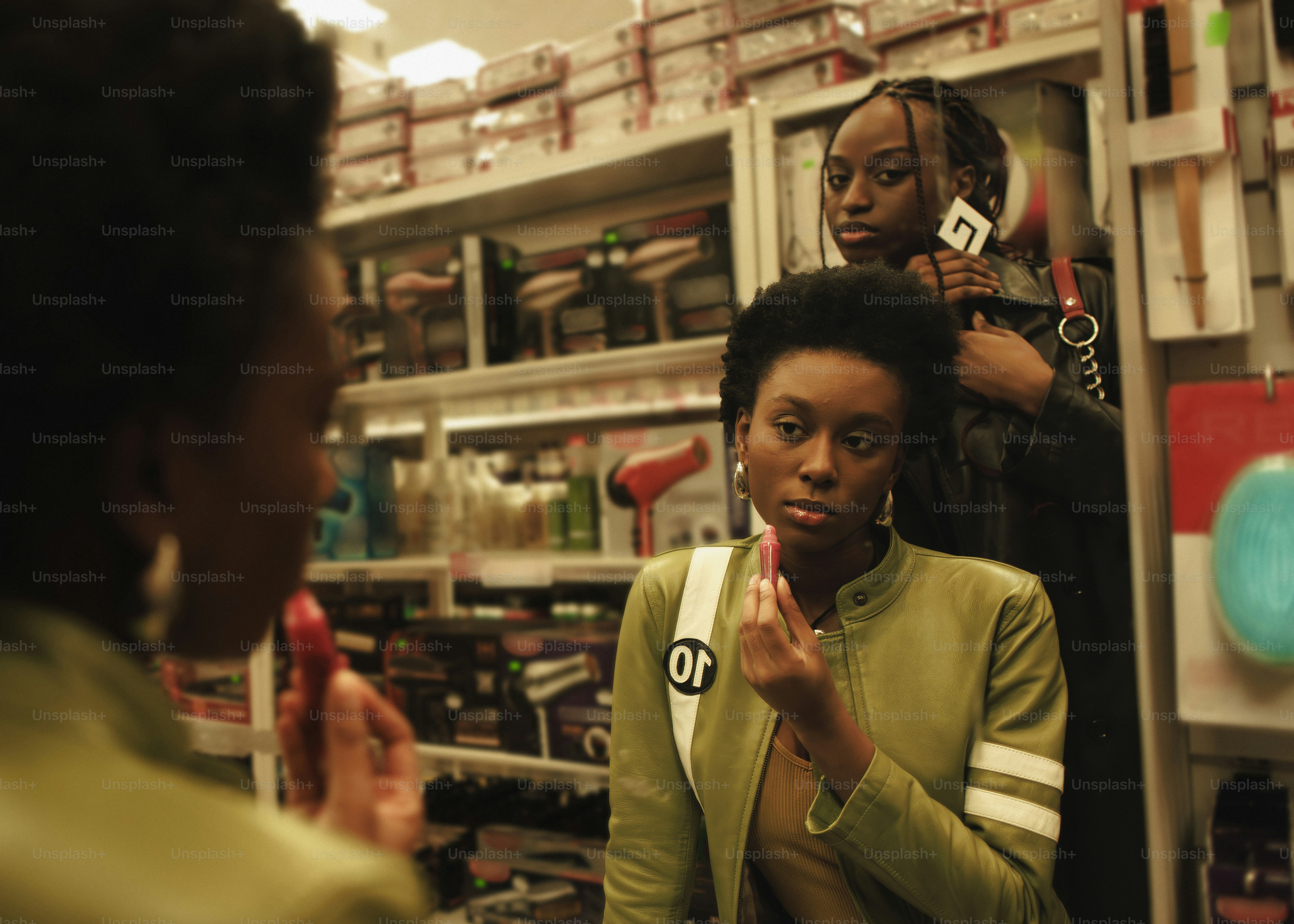 a woman standing in front of a mirror brushing her teeth