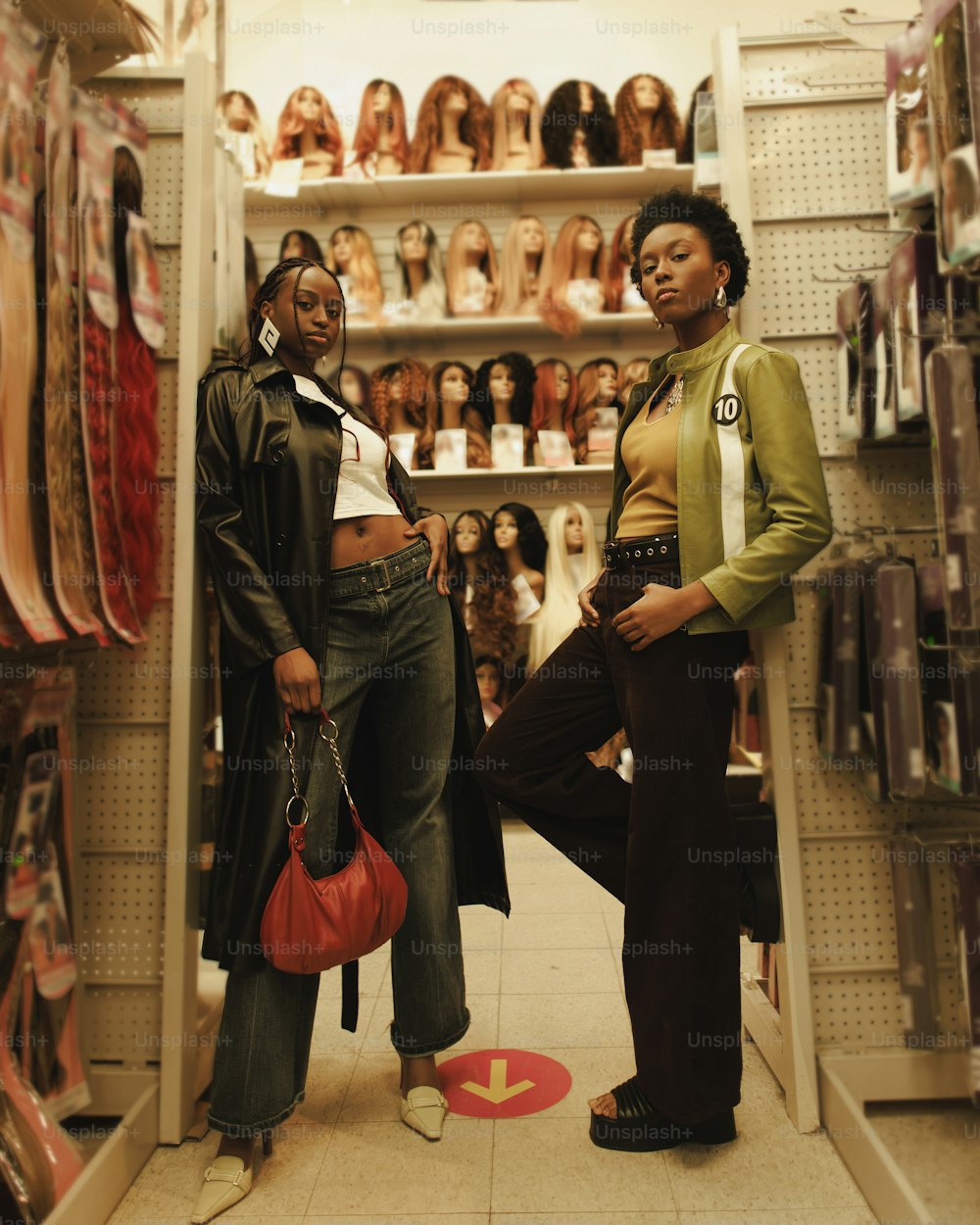a couple of women standing in a store next to each other