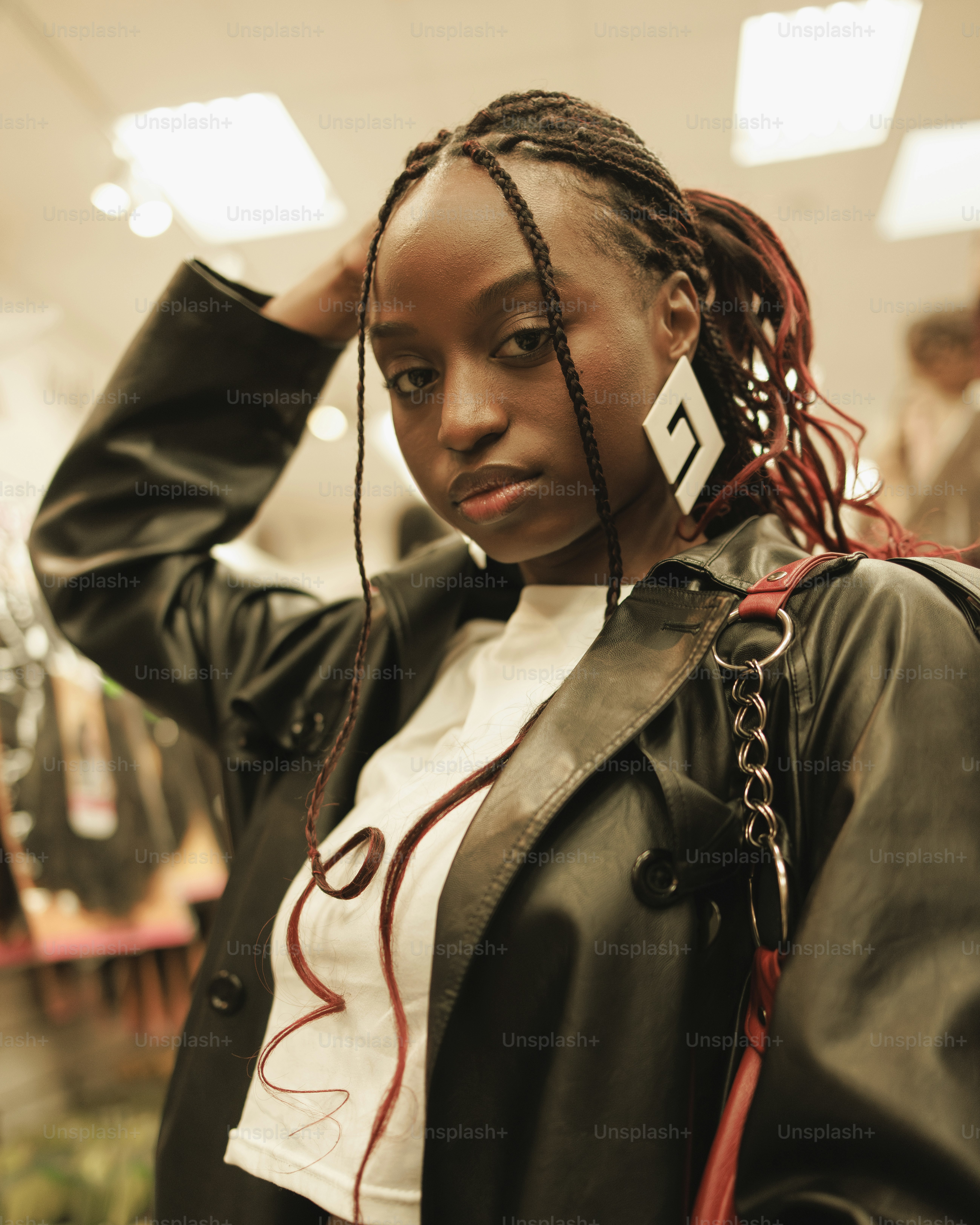 a woman with dreadlocks standing in a store