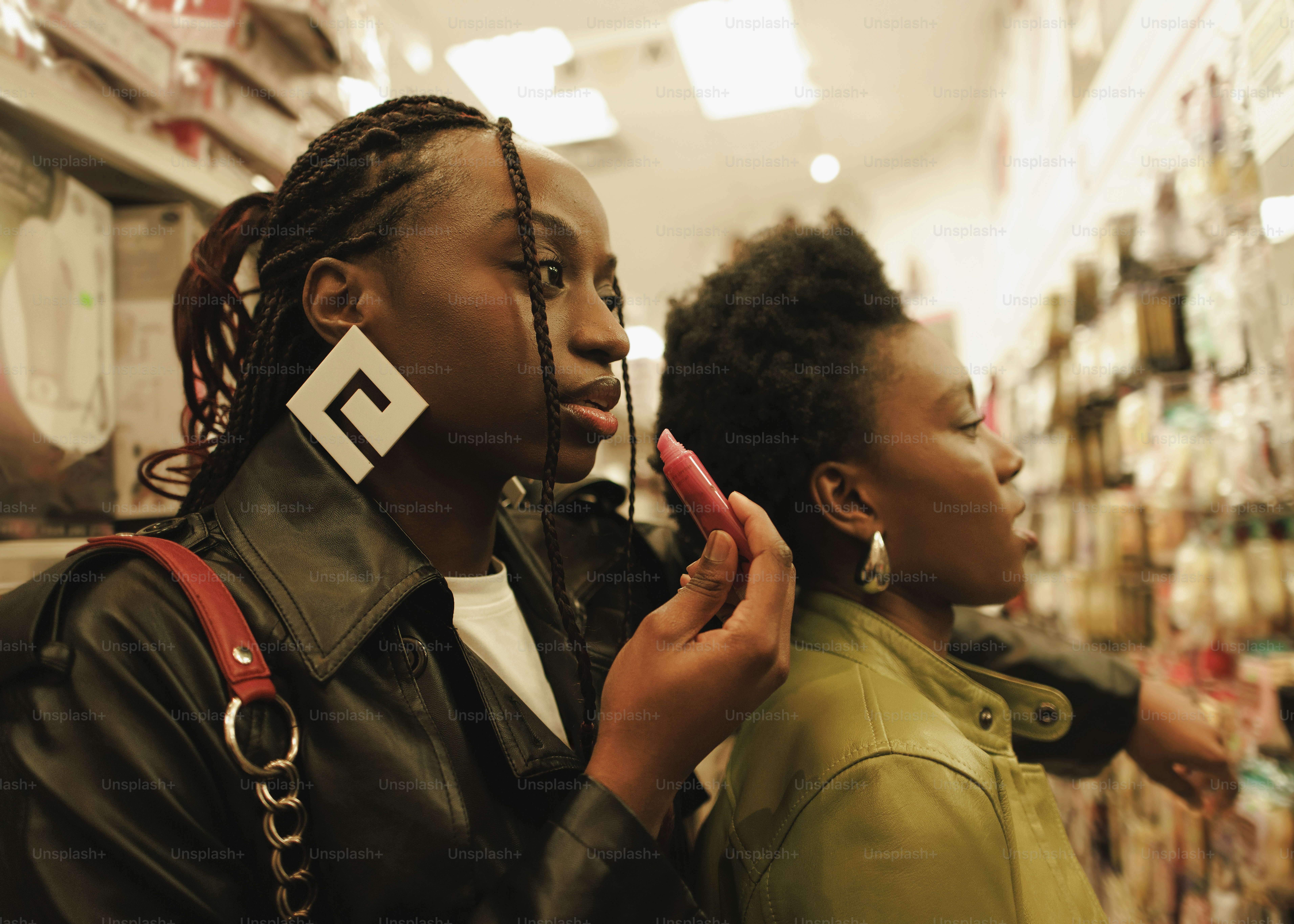 two women standing in a store looking at something