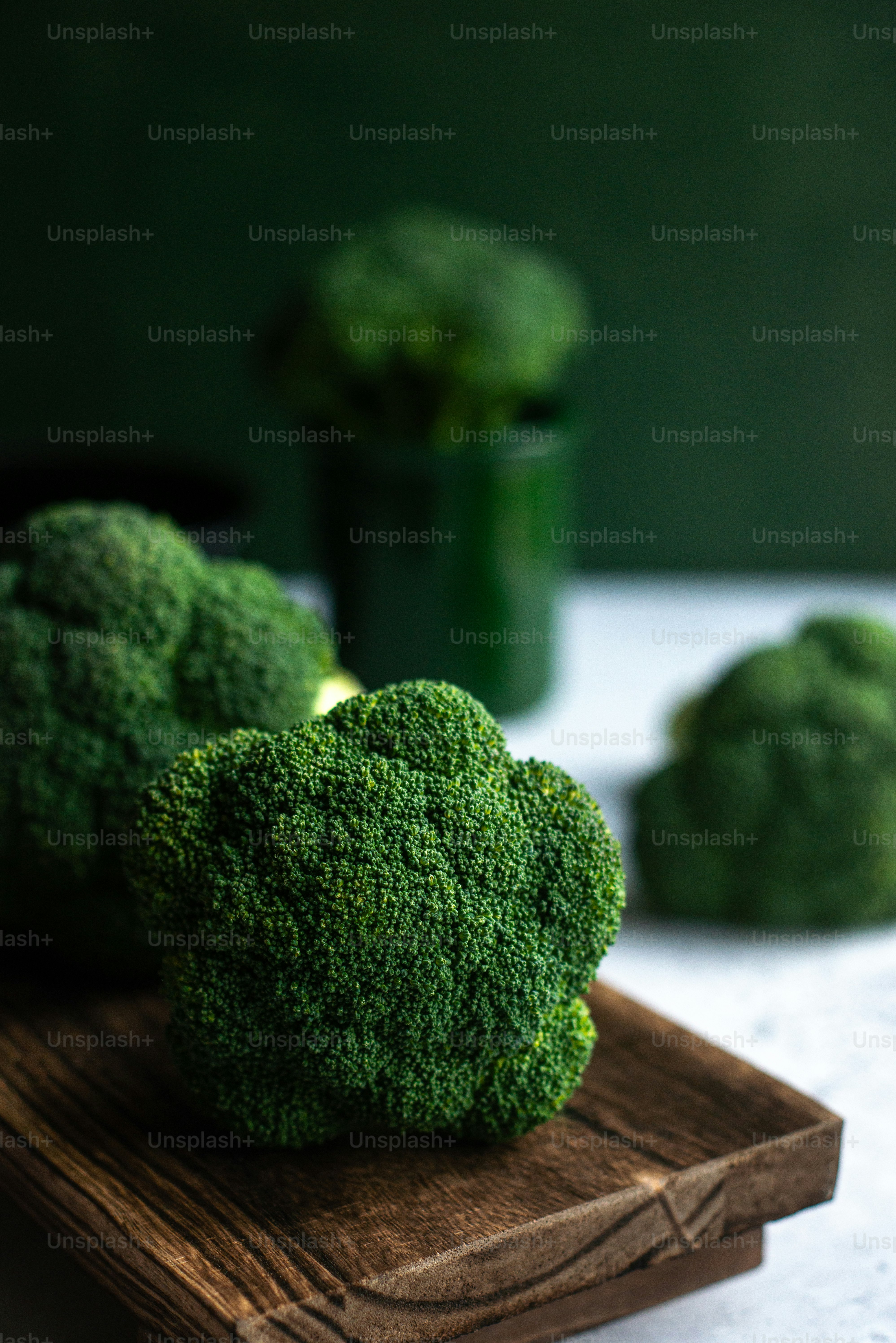 a close up of broccoli on a cutting board
