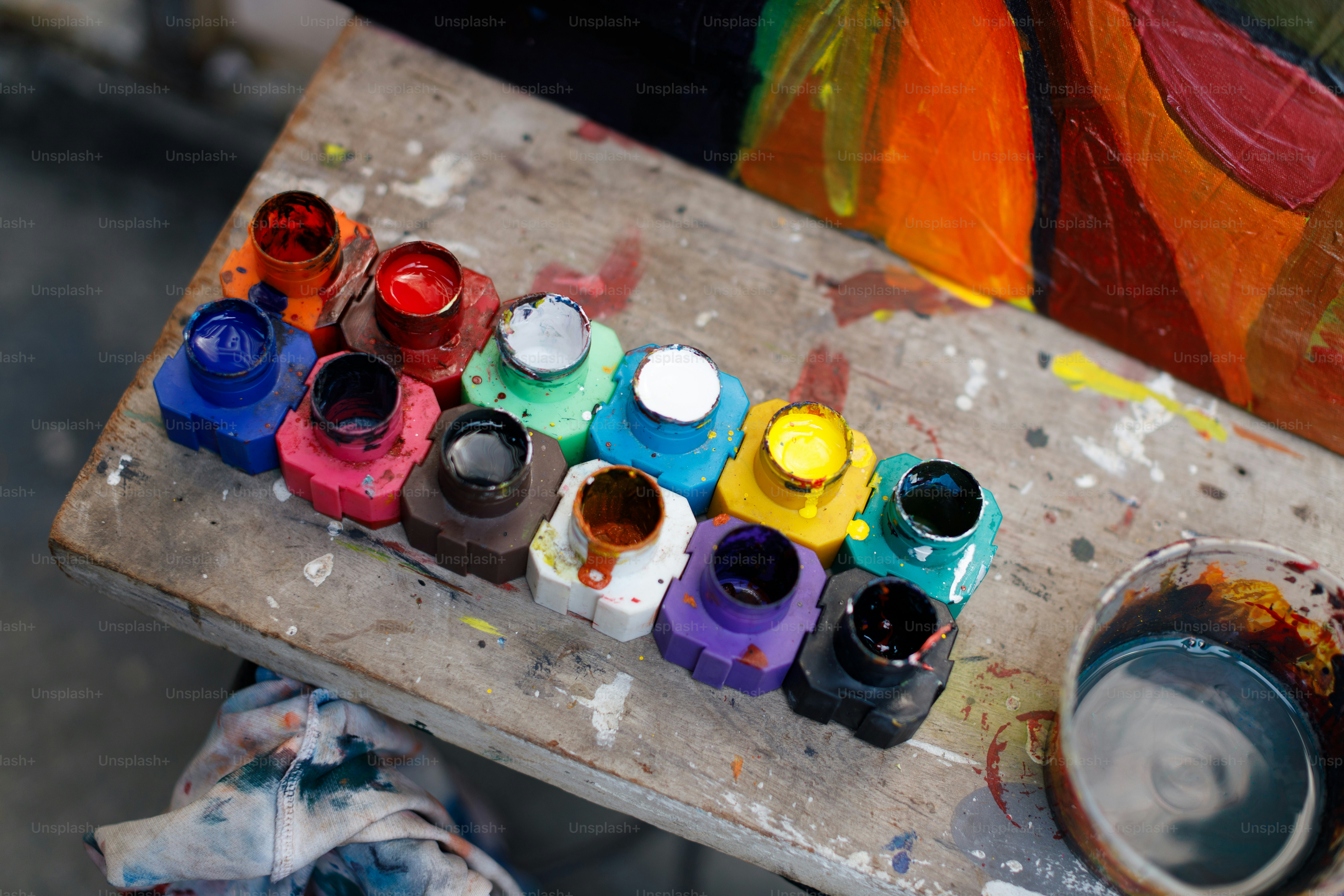 a close up of a table with paint and a palette