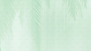 un fondo verde con palmeras en primer plano
