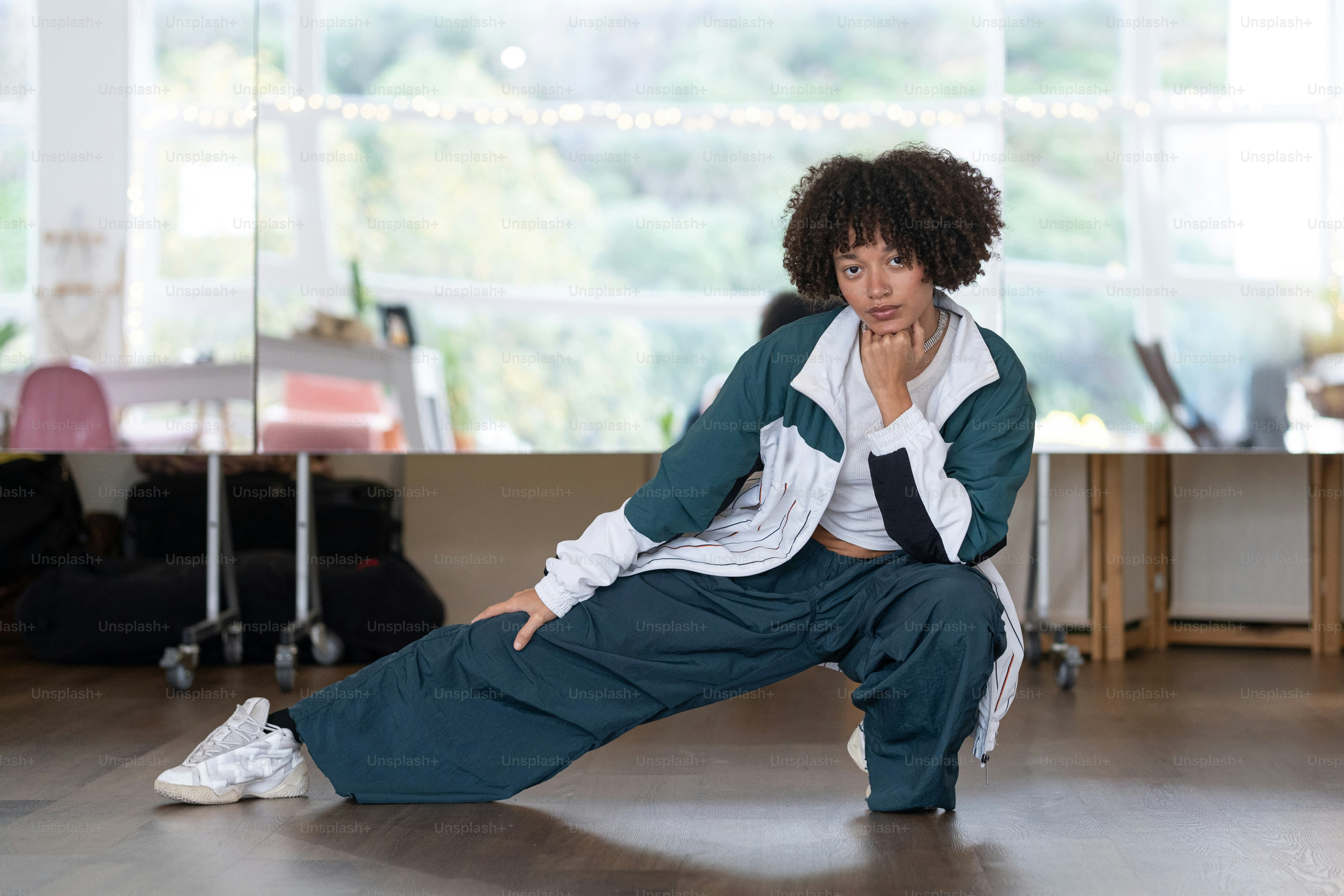 a woman sitting on the floor in a room