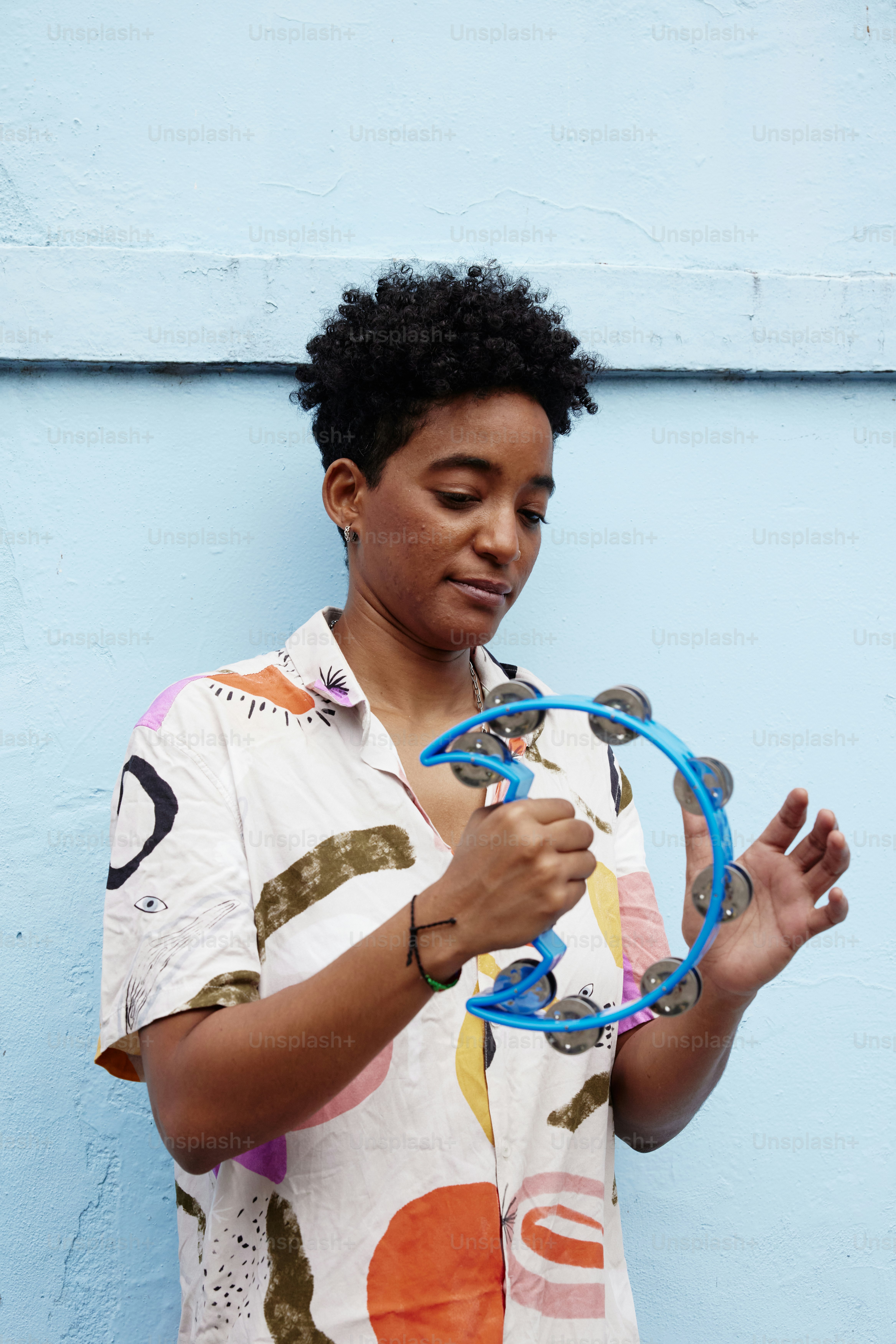a woman holding a pair of scissors in her hands