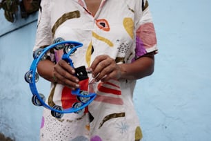 a woman holding a pair of scissors in her hands