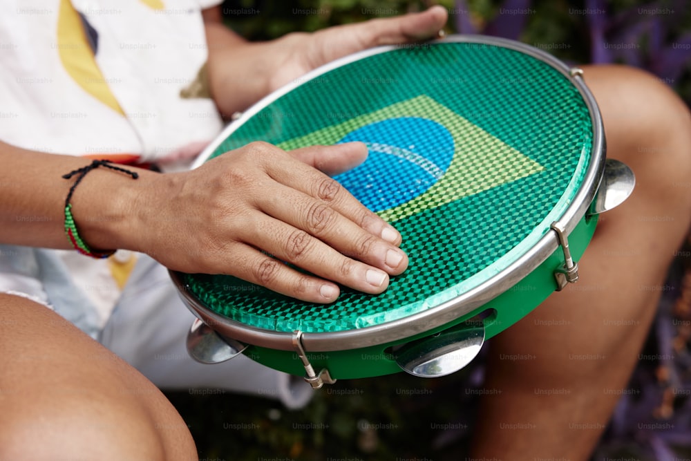 a close up of a person holding a frisbee