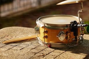a close up of a drum and a mallet
