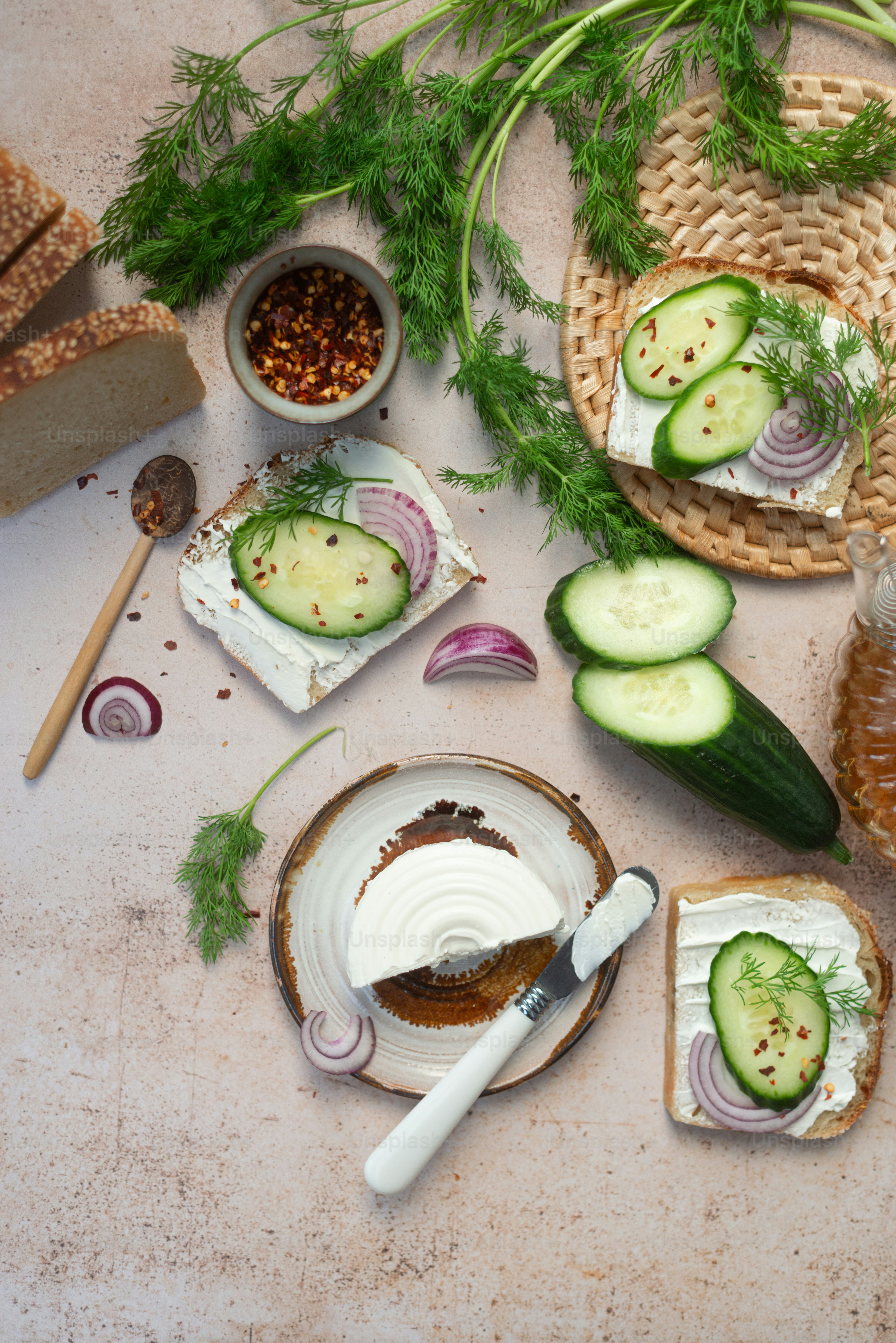 A plate with cucumbers and bread on it photo – Healthy greens Image on ...