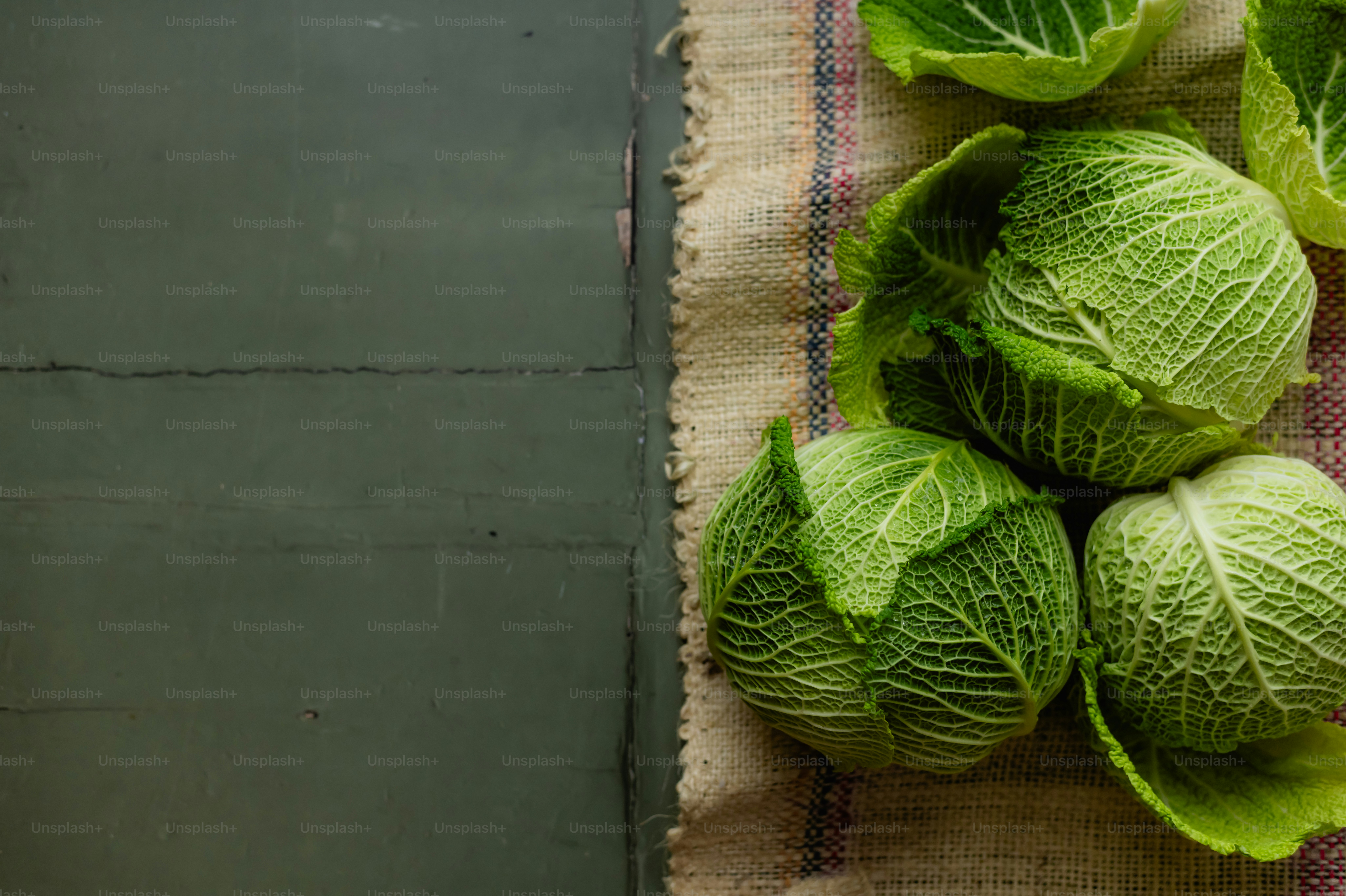 A bunch of green cabbage on a table photo Fresh veggies Image on Unsplash