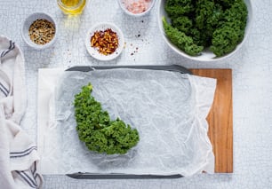 a cutting board topped with a piece of broccoli