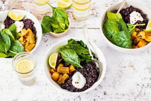 three bowls of food and drinks on a table