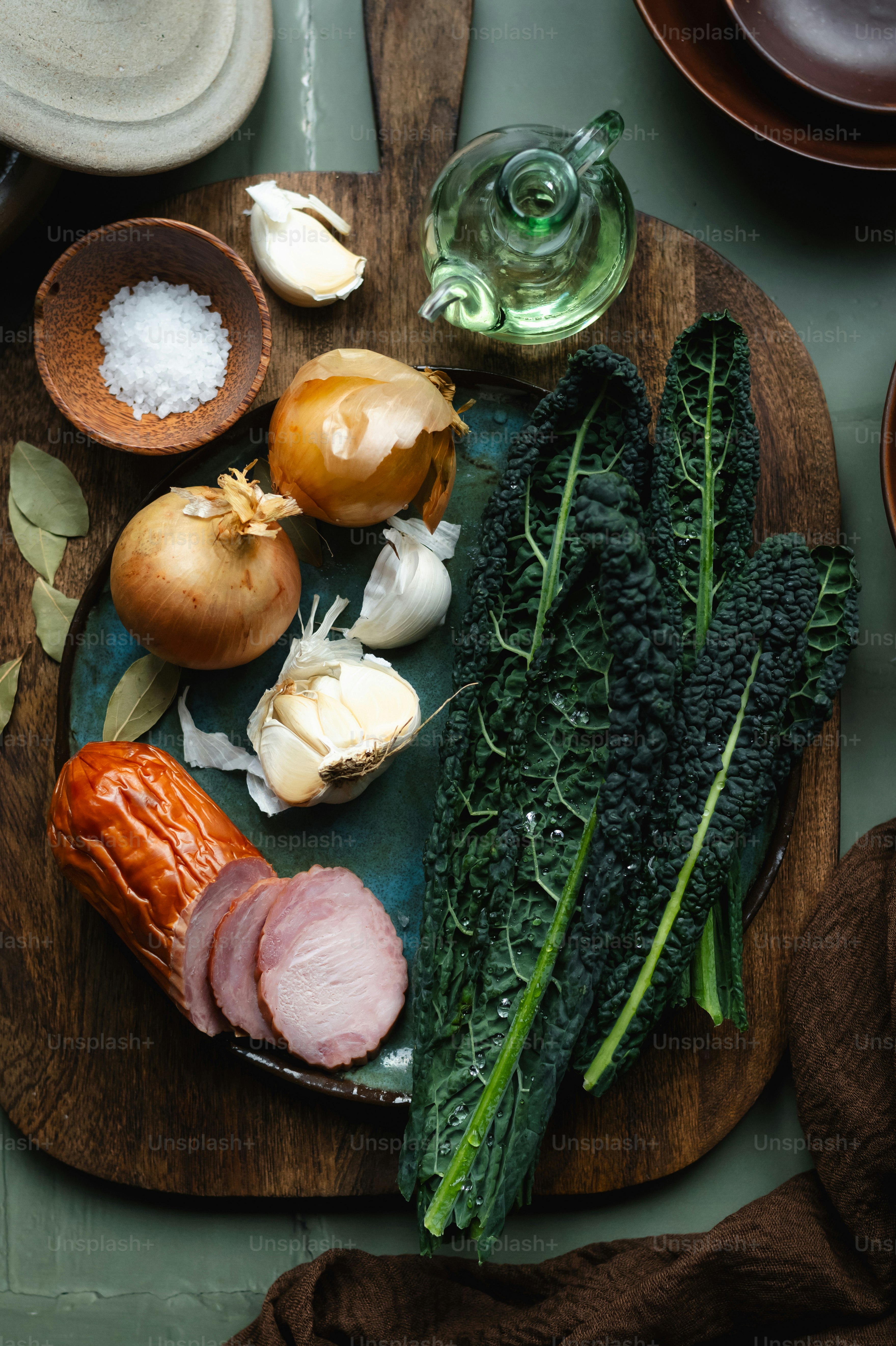 a wooden plate topped with different types of vegetables