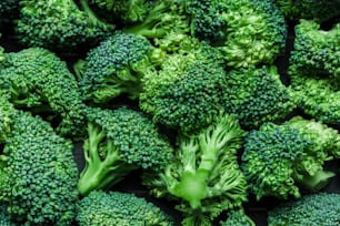 a pile of green broccoli florets sitting on top of each other