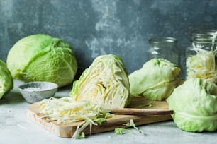 cabbage on a cutting board next to other vegetables