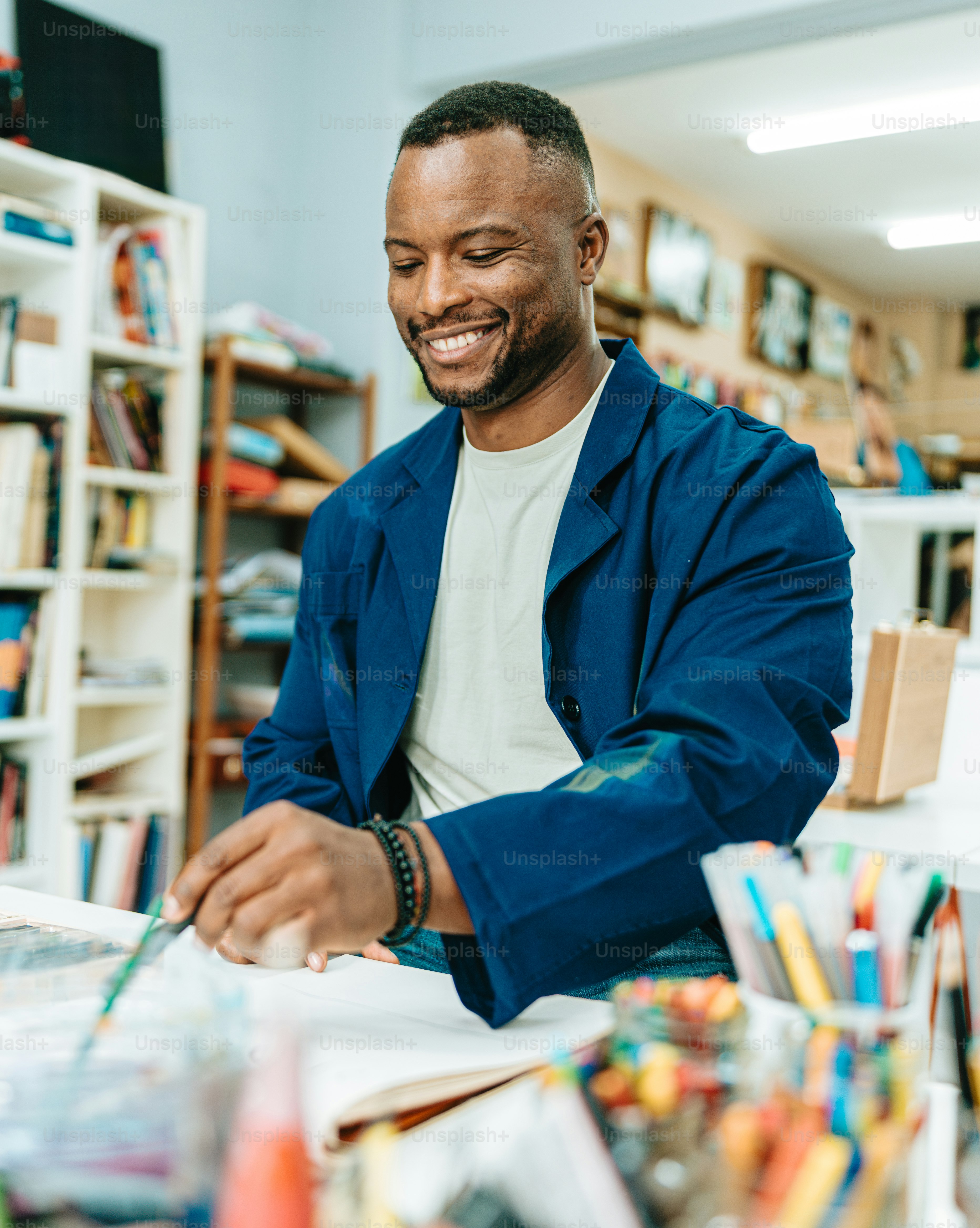 a man sitting at a desk in a library