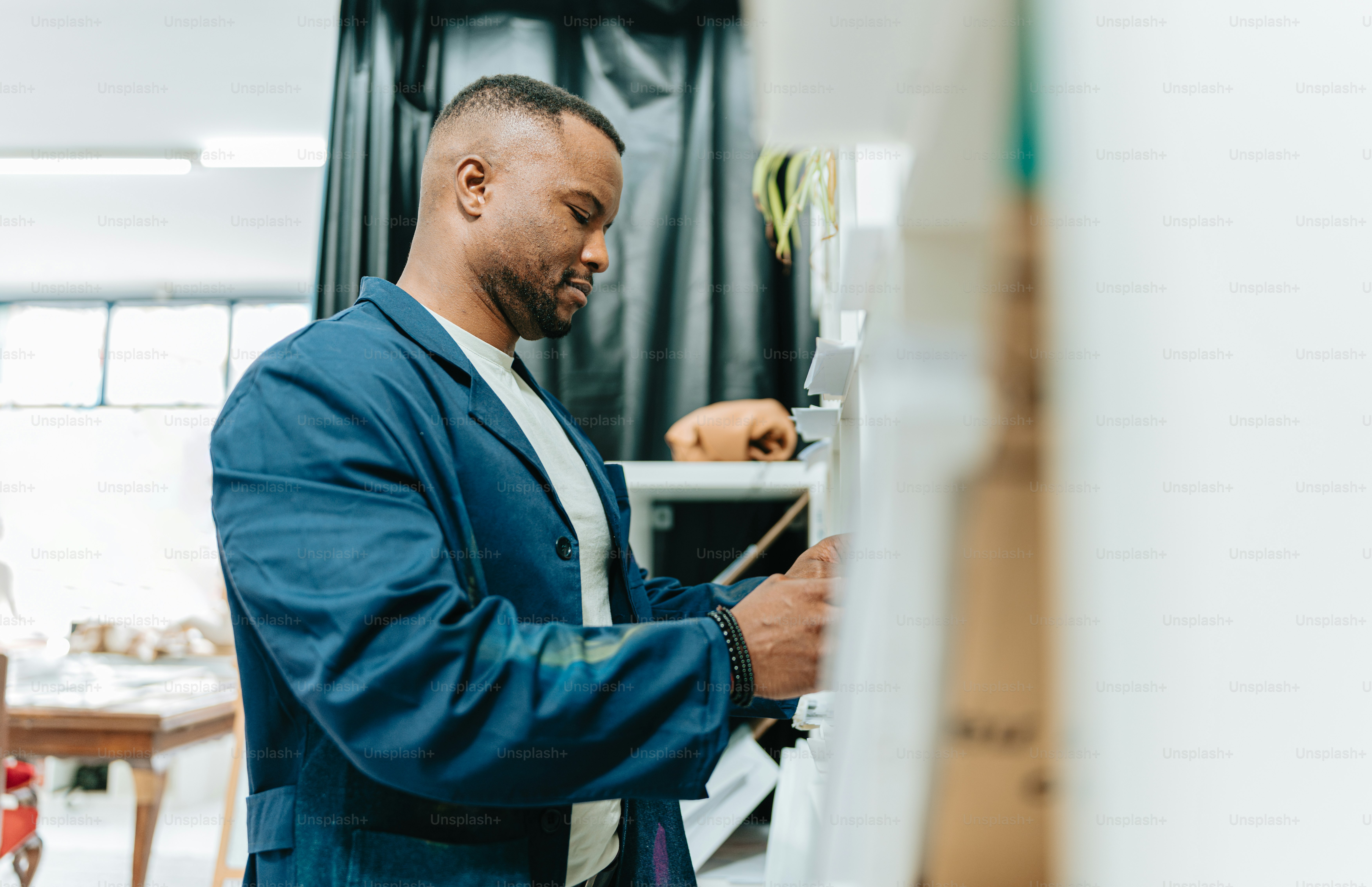 a man in a suit is looking at a piece of paper
